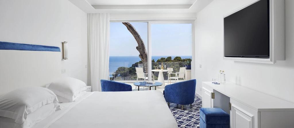 Posteľ alebo postele v izbe v ubytovaní Hotel Scalinatella