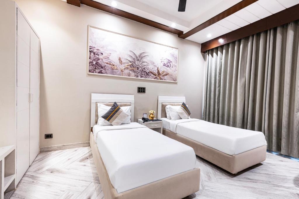 Skon Boutique by Orion Hotels客房内的一张或多张床位