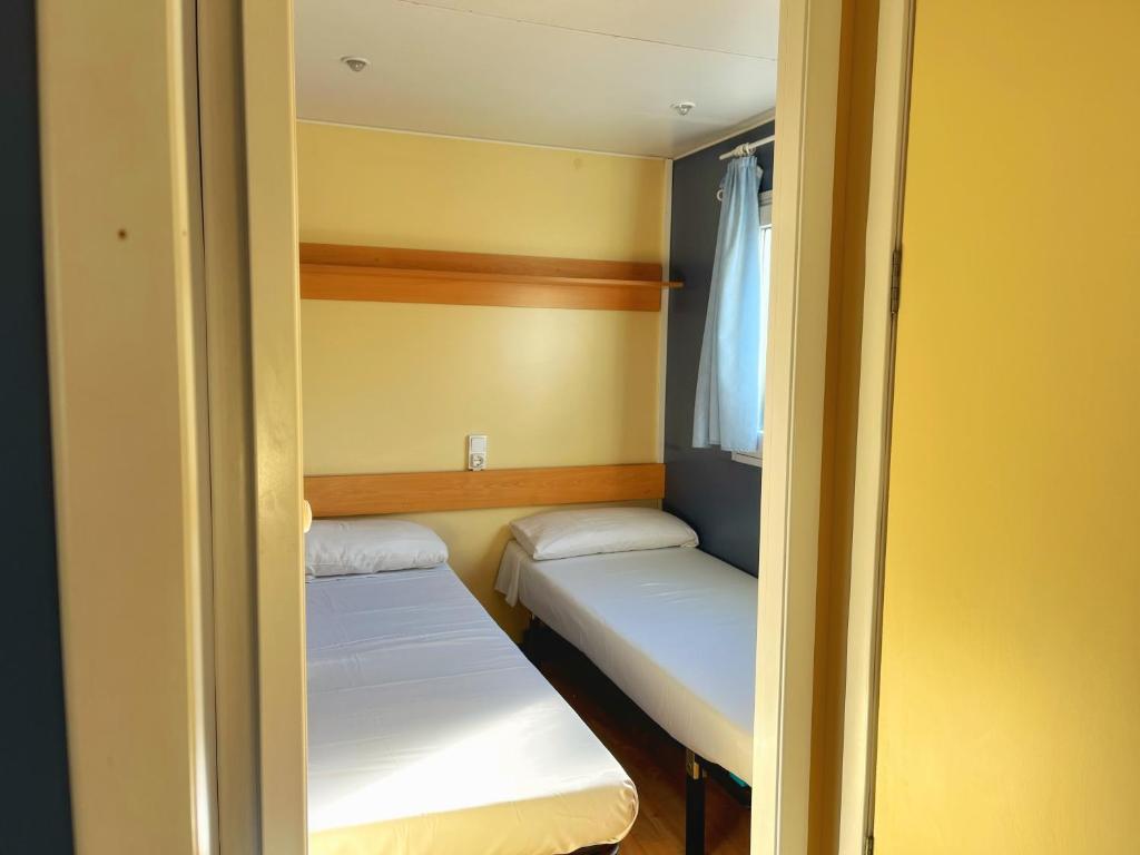 Postel nebo postele na pokoji v ubytování ARES Ecoresort