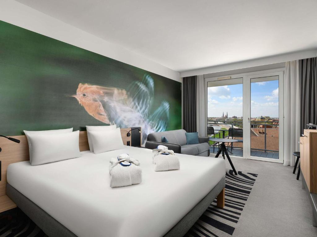 Postel nebo postele na pokoji v ubytování Novotel Szeged