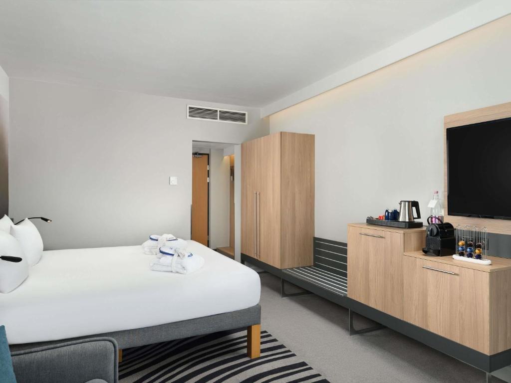 Postel nebo postele na pokoji v ubytování Novotel Szeged