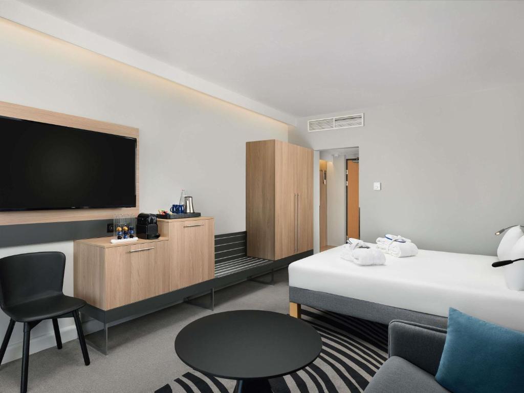 Postel nebo postele na pokoji v ubytování Novotel Szeged