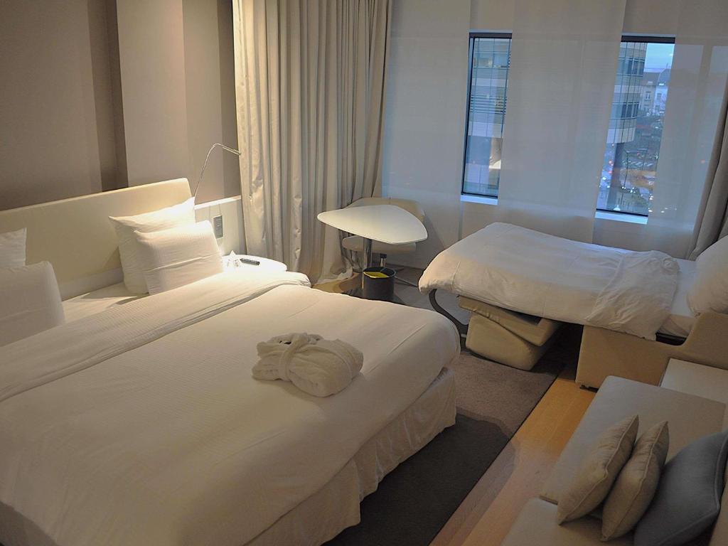 Postel nebo postele na pokoji v ubytování Pullman Brussels Centre Midi