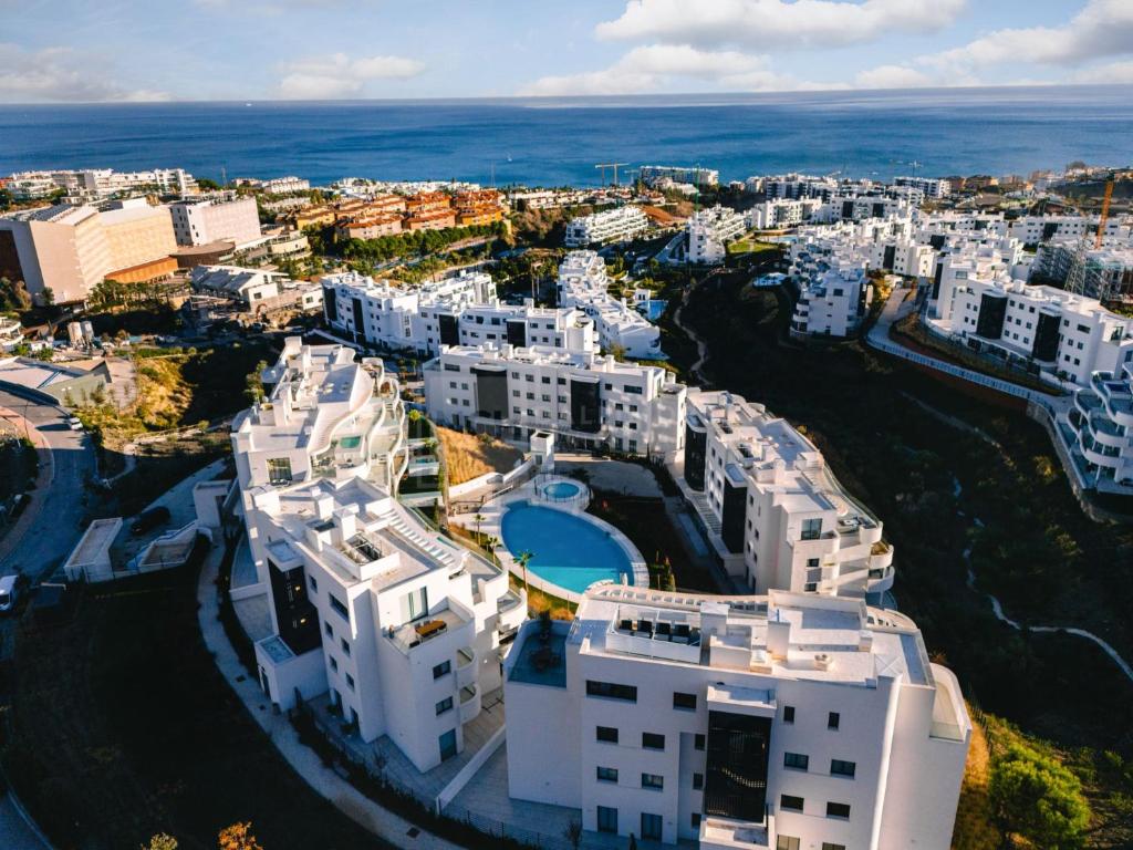 an aerial view of a city with white buildings at Higuerón 5821 in Málaga