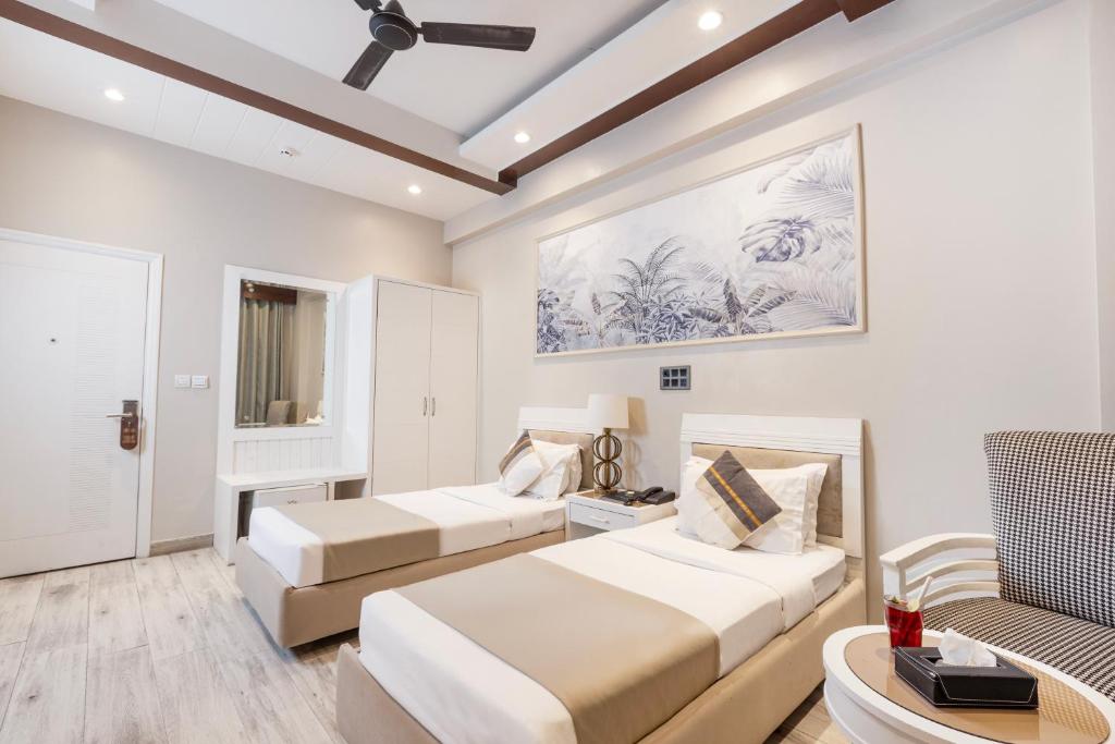 Skon Boutique by Orion Hotels客房内的一张或多张床位