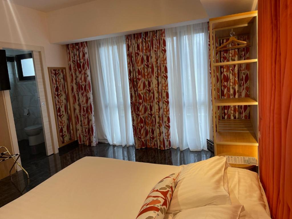 Postel nebo postele na pokoji v ubytování Hotel Sant'Elia