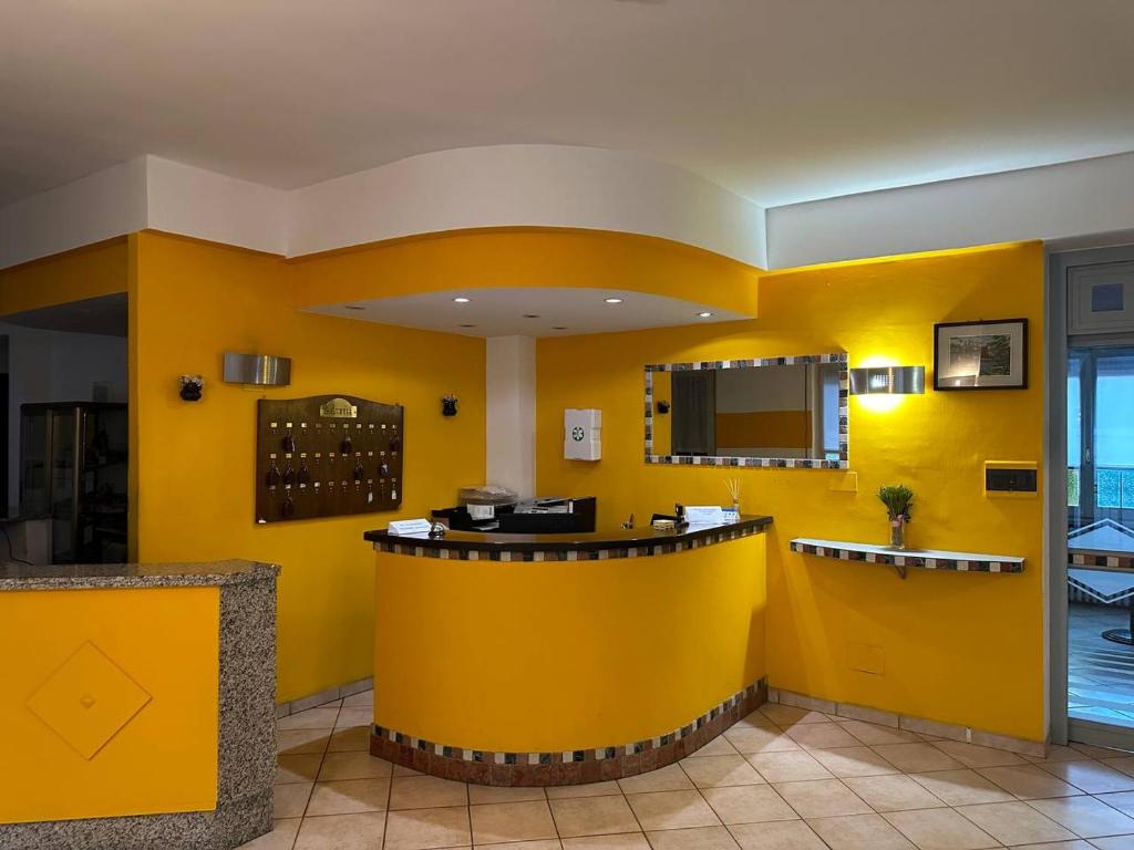A television and/or entertainment centre at BE ME Hotel Helvetia