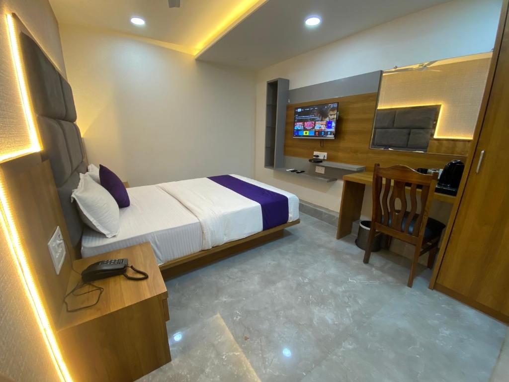 TV a/nebo společenská místnost v ubytování Hotel BKC Gold View