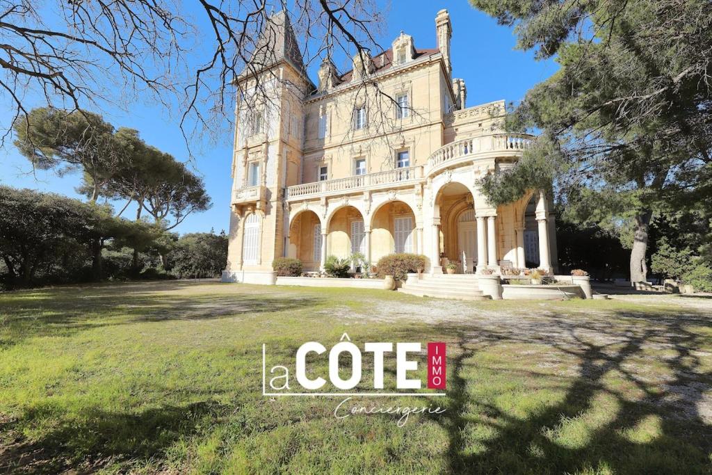 an old house with a coffee sign in front of it at Château Charles Roux in Sausset-les-Pins