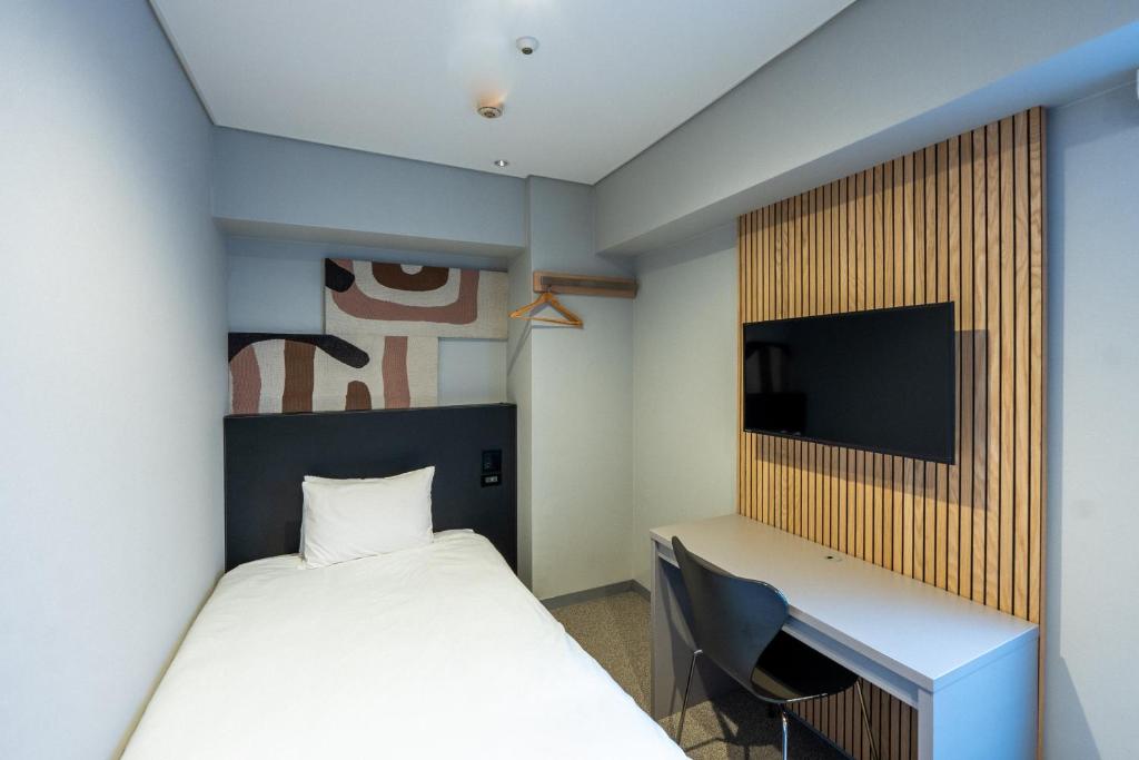 TV a/nebo společenská místnost v ubytování WPÜ HOTEL Shinjuku