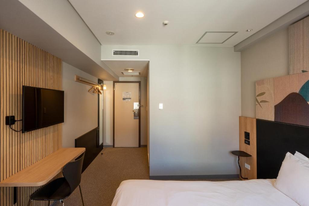 TV a/nebo společenská místnost v ubytování WPÜ HOTEL Shinjuku