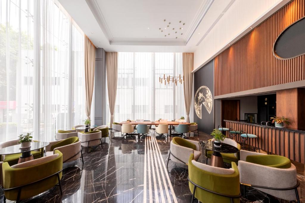 Posezení v ubytování Shenzhen Longgang Central City Jinjiang Metropolo Hotel