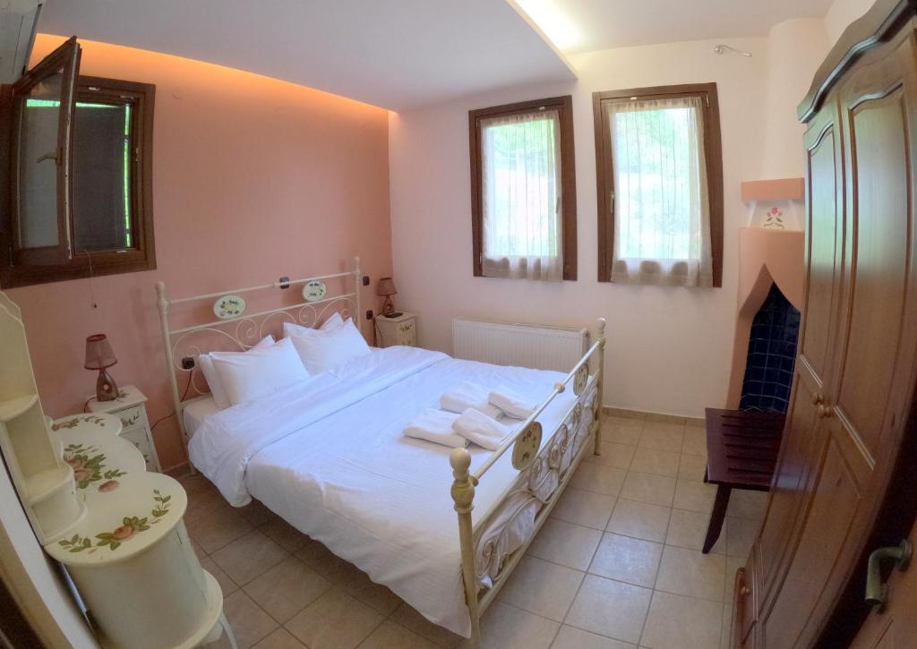 Postel nebo postele na pokoji v ubytování RASTONI Pelion