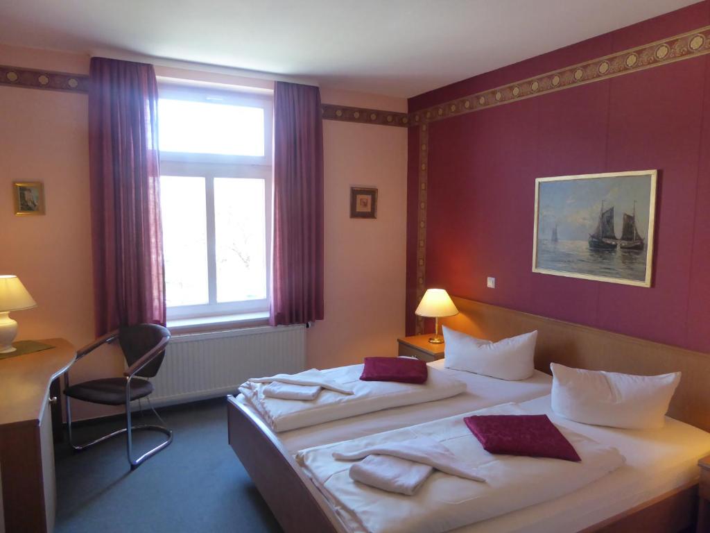 Postel nebo postele na pokoji v ubytování Hotel Koos