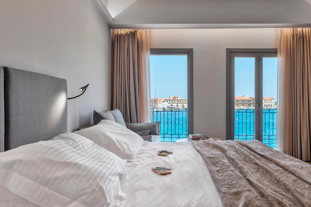 Postel nebo postele na pokoji v ubytování Naves Suites