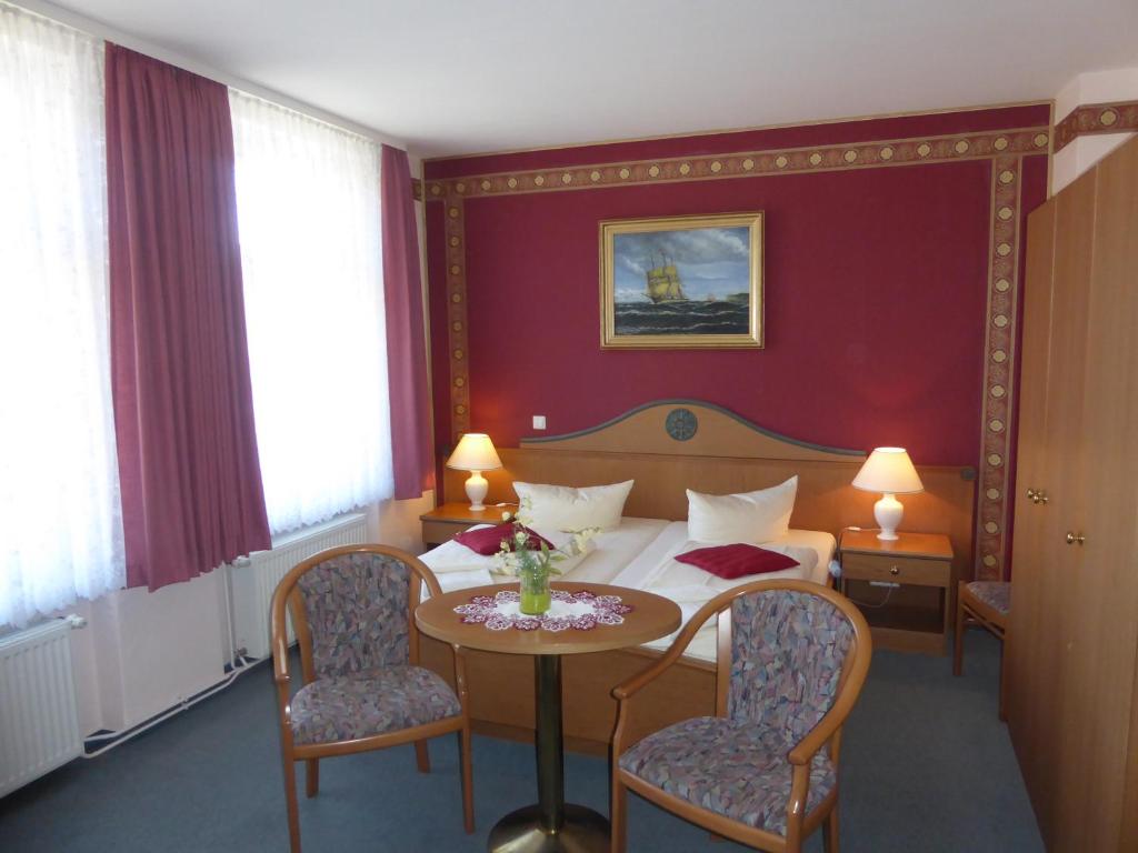 Postel nebo postele na pokoji v ubytování Hotel Koos