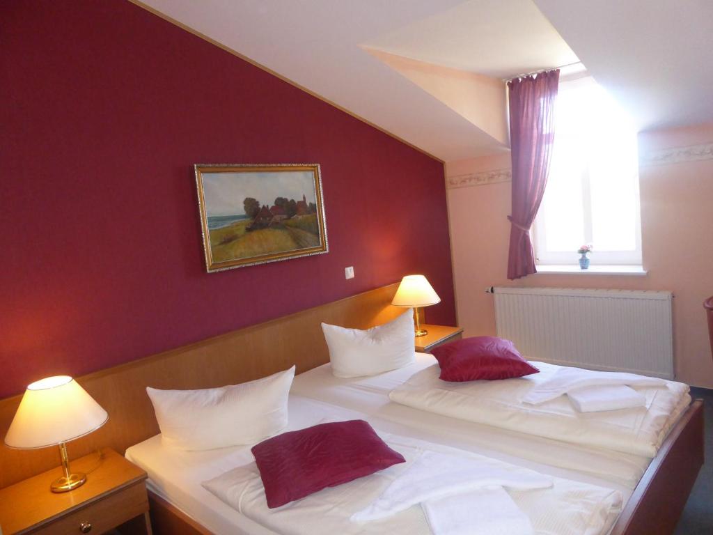 Postel nebo postele na pokoji v ubytování Hotel Koos