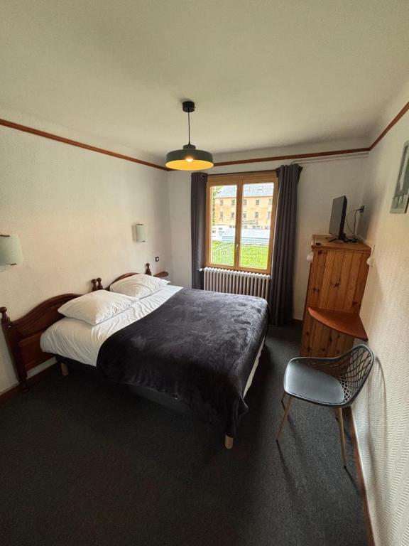 Postel nebo postele na pokoji v ubytování Hotel le Taillon