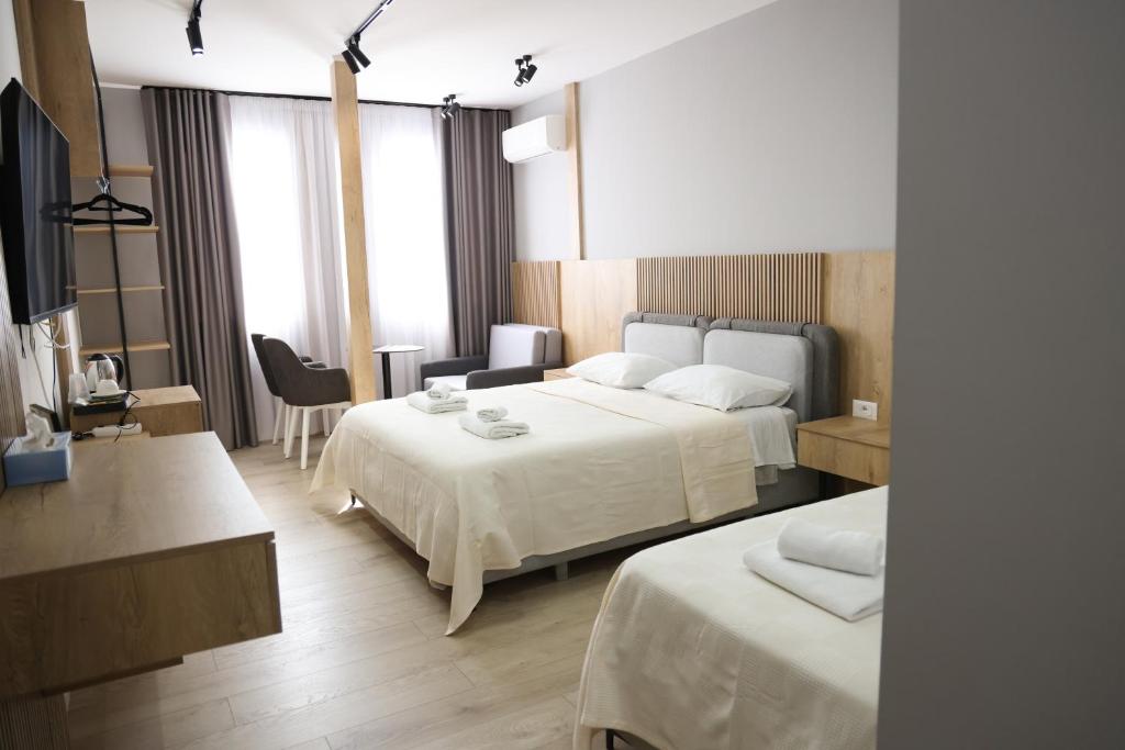 Postel nebo postele na pokoji v ubytování Sol Hotel