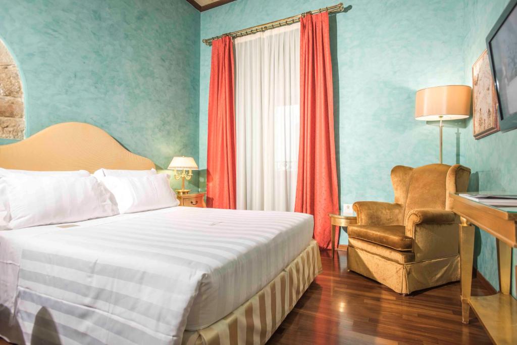 Postel nebo postele na pokoji v ubytování Golden Tower Hotel & Spa