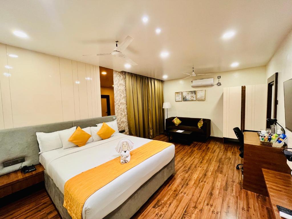 Postel nebo postele na pokoji v ubytování Shankar Bhavan By Vinayak Hotels