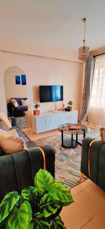 TV a/nebo společenská místnost v ubytování Reigns cozy corner