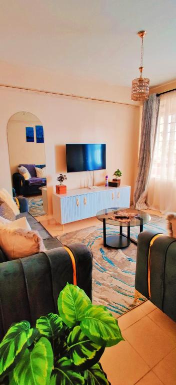 TV a/nebo společenská místnost v ubytování Reigns cozy corner