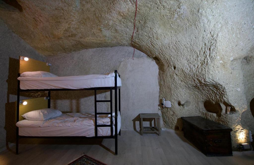 Postel nebo postele na pokoji v ubytování Center cave hostel