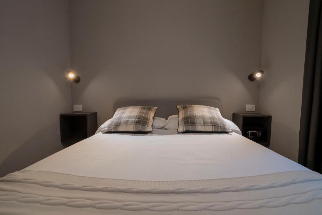 Postel nebo postele na pokoji v ubytování Condhotel Fanti