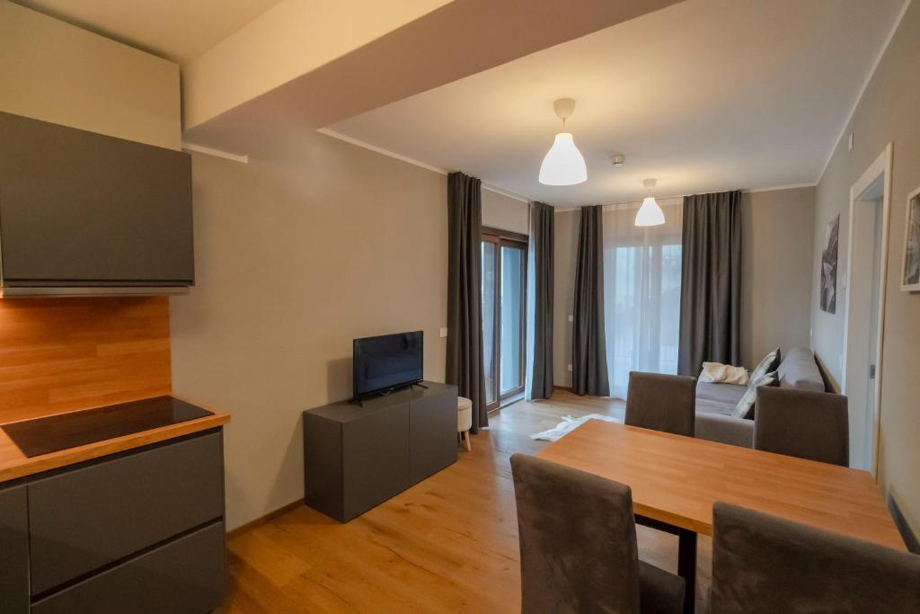 TV a/nebo společenská místnost v ubytování Condhotel Fanti
