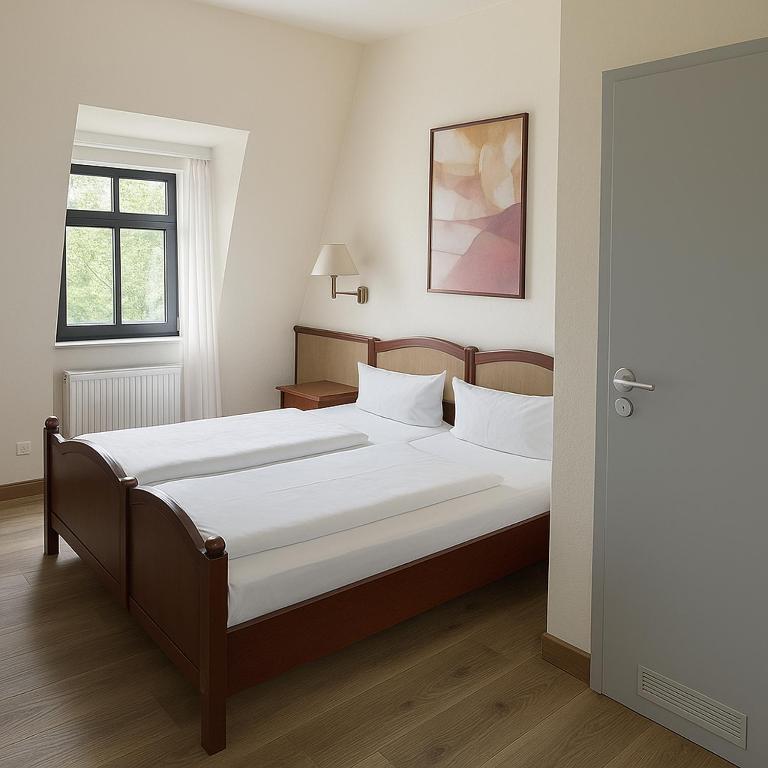 Postel nebo postele na pokoji v ubytování Hotel Villa Kipping am Hauptbahnhof