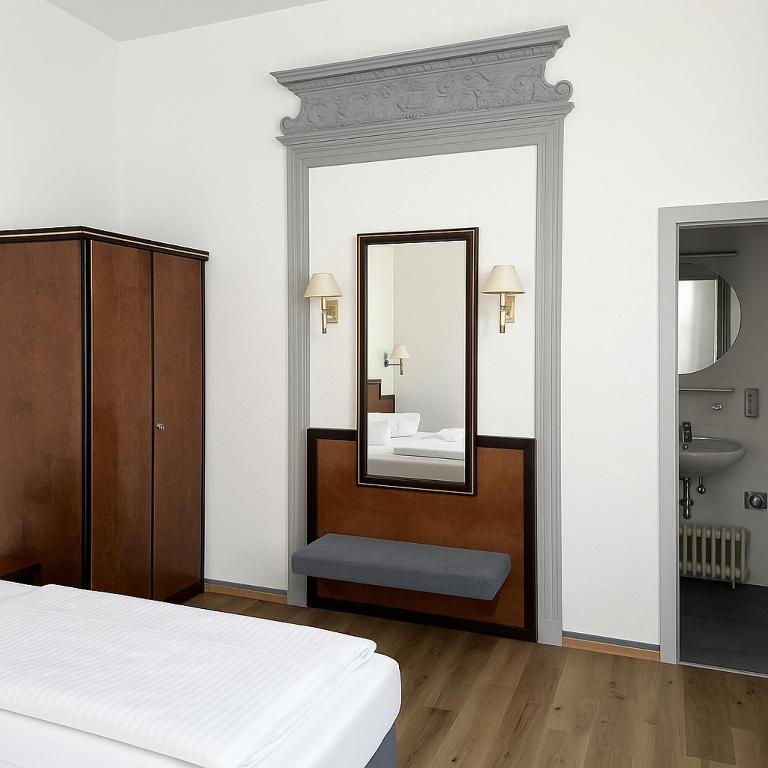 Postel nebo postele na pokoji v ubytování Hotel Villa Kipping am Hauptbahnhof