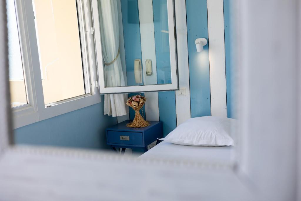 Postel nebo postele na pokoji v ubytování Cap Nègre Hôtel