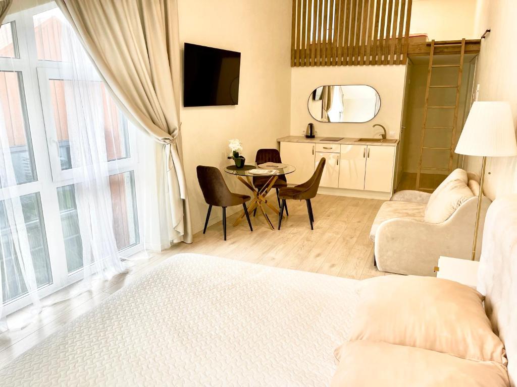 Televizorius ir (arba) pramogų centras apgyvendinimo įstaigoje Seaside apartments 3