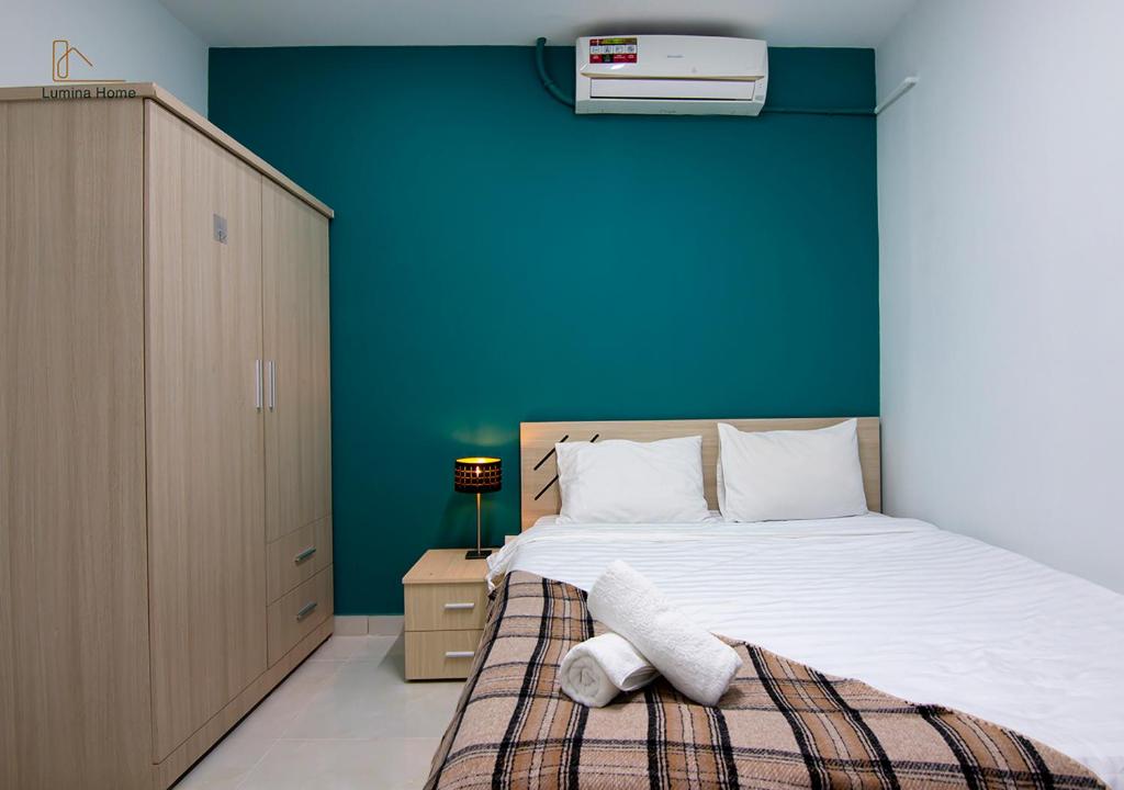 Postel nebo postele na pokoji v ubytování Lumina Home
