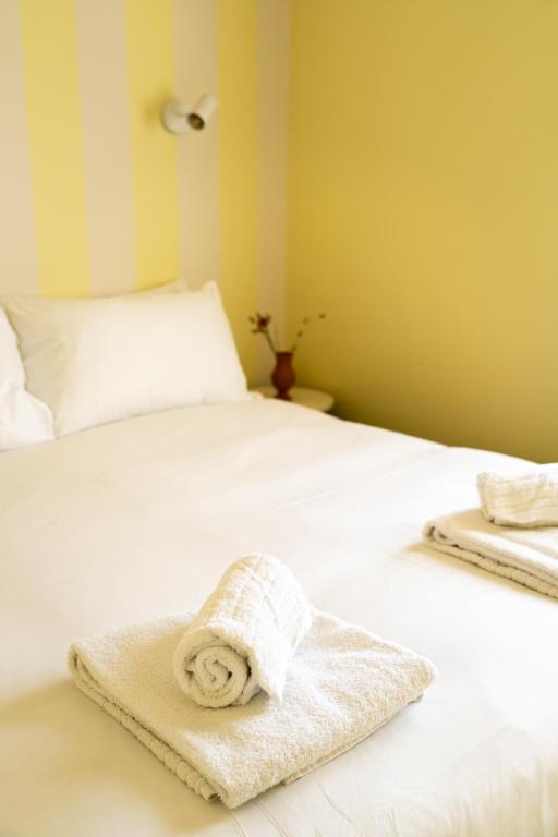 Postel nebo postele na pokoji v ubytování Hotel Bleu Soleil