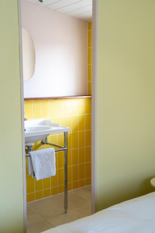 Postel nebo postele na pokoji v ubytování Hotel Bleu Soleil