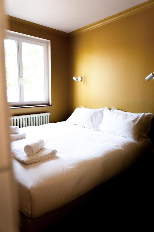 Postel nebo postele na pokoji v ubytování Hotel Bleu Soleil