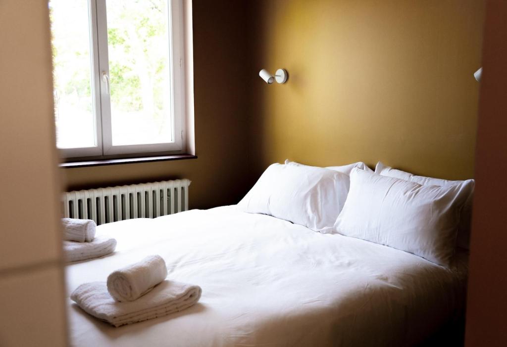 Postel nebo postele na pokoji v ubytování Hotel Bleu Soleil