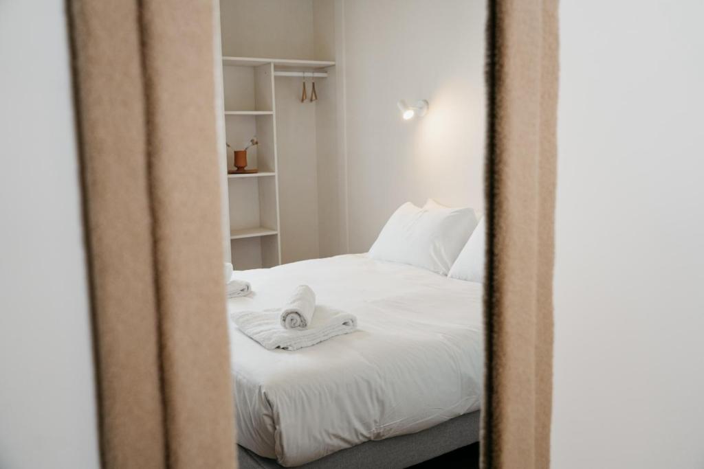 Postel nebo postele na pokoji v ubytování Hotel Bleu Soleil