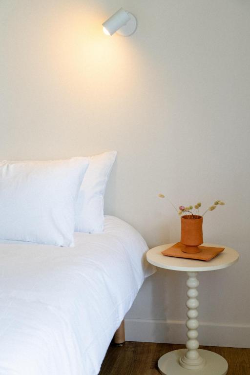 Postel nebo postele na pokoji v ubytování Hotel Bleu Soleil