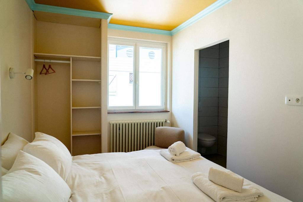 Postel nebo postele na pokoji v ubytování Hotel Bleu Soleil