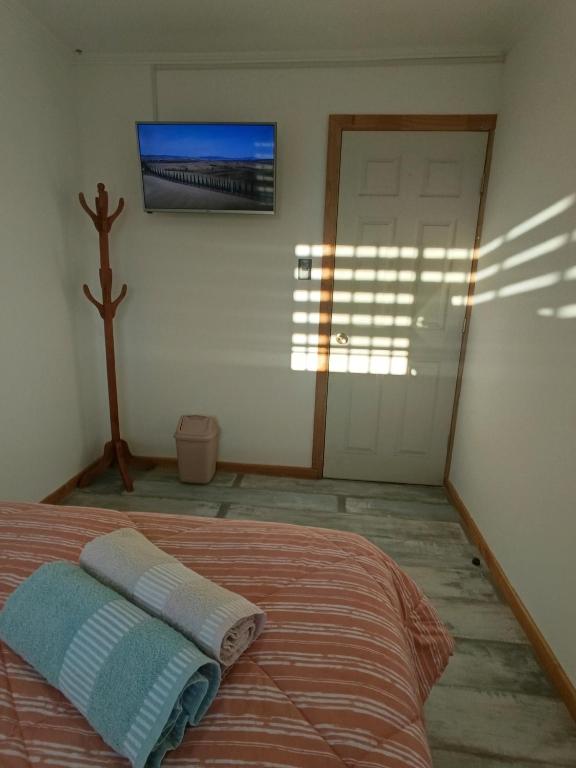 Postel nebo postele na pokoji v ubytování Hostel Rogiel - A 10 min del Aeropuerto con Recojo Gratis