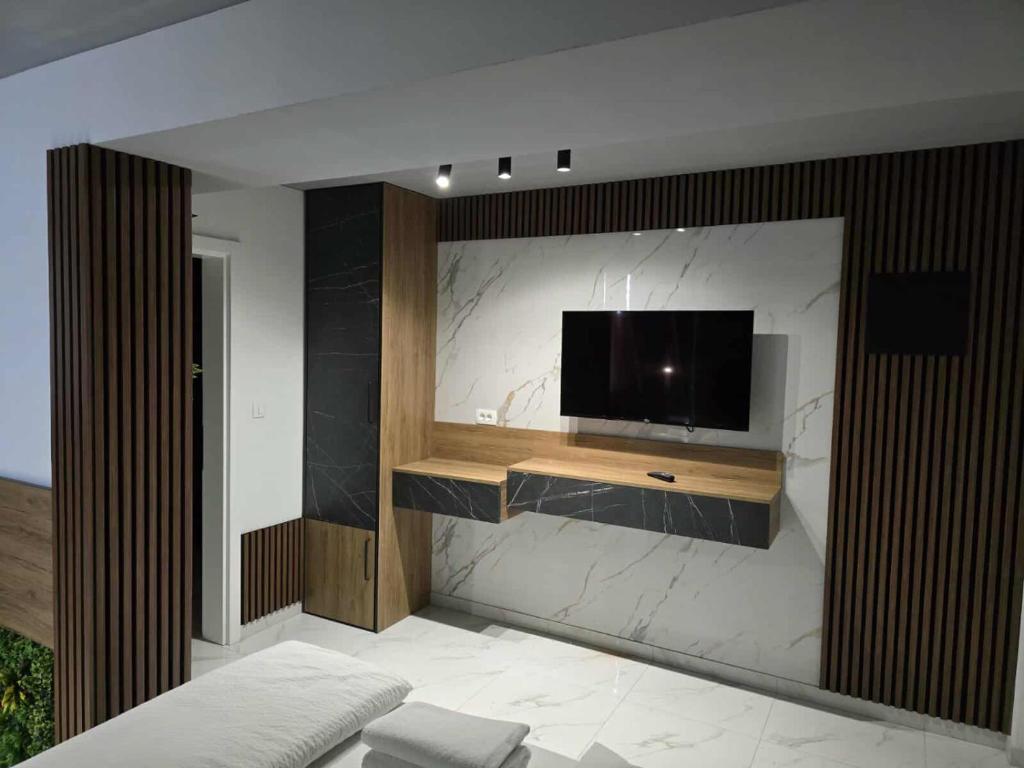 TV a/nebo společenská místnost v ubytování Hotel Villa Nadin