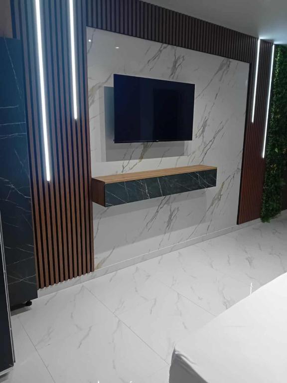 TV a/nebo společenská místnost v ubytování Hotel Villa Nadin