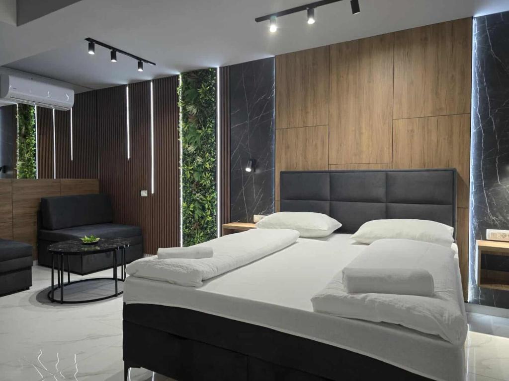 Postel nebo postele na pokoji v ubytování Hotel Villa Nadin