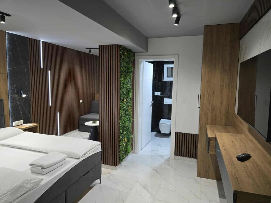 Postel nebo postele na pokoji v ubytování Hotel Villa Nadin