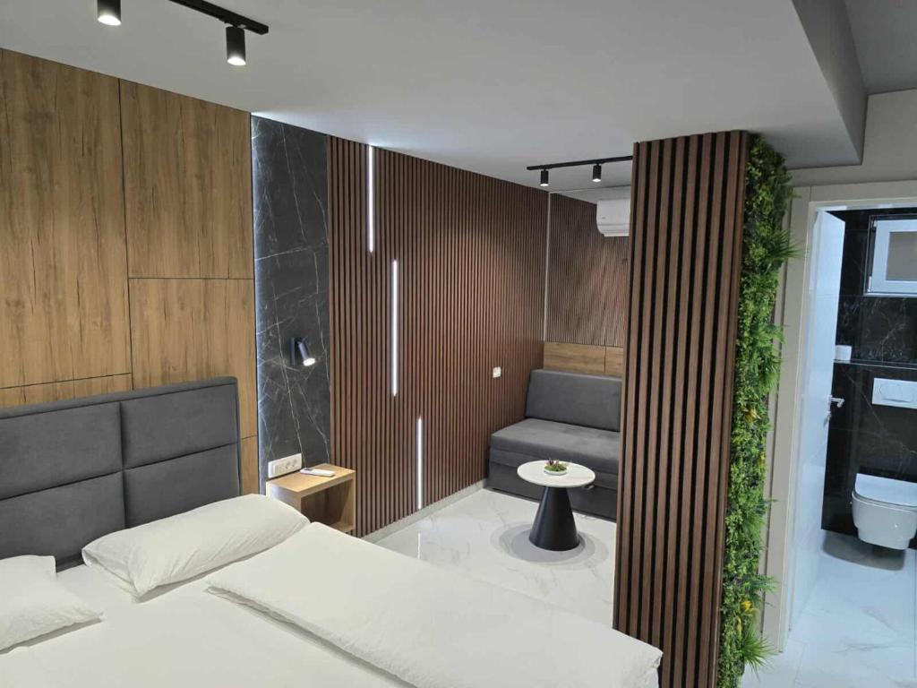 Postel nebo postele na pokoji v ubytování Hotel Villa Nadin