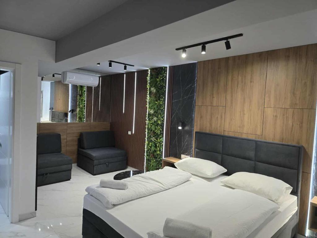 Postel nebo postele na pokoji v ubytování Hotel Villa Nadin