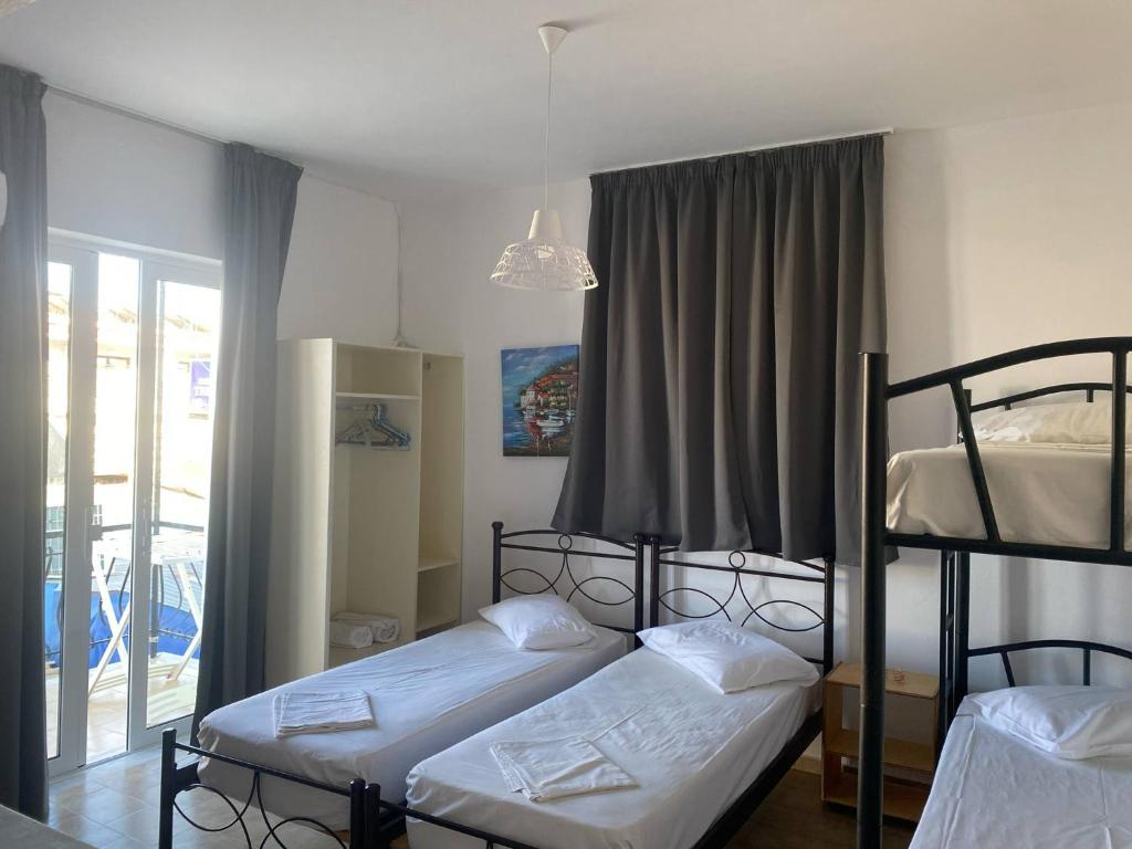 Postel nebo postele na pokoji v ubytování Mary Studios